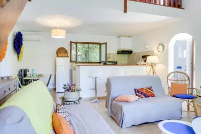a living room with a couch and a chair at Villa Bossangoa in Cervione