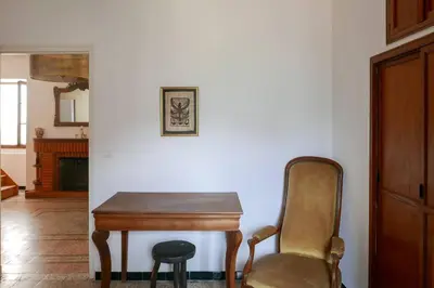a table and a chair in a living room at I MONTI SIGNORI in Porto Ota