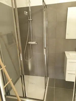 a shower with a glass door in a bathroom at Appartement 2 pièces dans le centre historique de Porto Vecchio in Porto-Vecchio