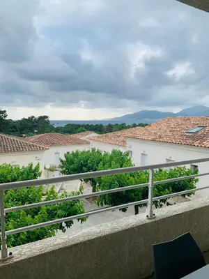 a view from the balcony of a house at APPARTEMENT DUPLEX PORTICCIO Centre in Porticcio