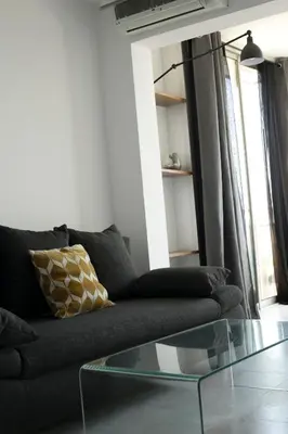 a living room with a couch and a glass table at Mare e Vista in Ajaccio