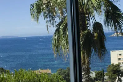 a view of the ocean from a window at Mare e Vista in Ajaccio