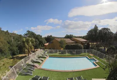 an overhead view of a swimming pool with chairs and a house at Chez Pierre à Porto-Vecchio in Porto-Vecchio