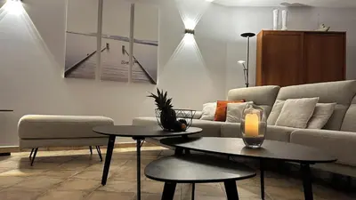 a living room with a couch and a table at PROPRIANO in Propriano