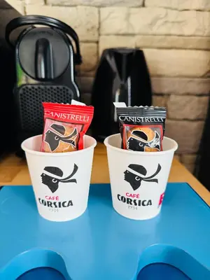 two buckets of snacks sitting on a table at 