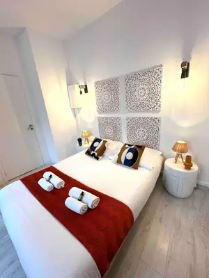 a bedroom with a large bed with towels on it at 