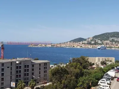 a view of a city with a bridge in the water at Zen home in Ajaccio