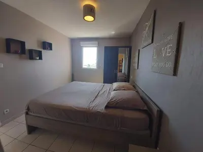 a bedroom with a bed in a room at Zen home in Ajaccio