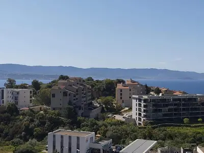 an aerial view of a city with buildings and the water at Zen home in Ajaccio