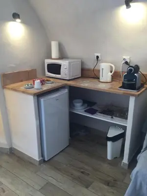 a kitchen with a counter top with a microwave and a microwave at Casa LiLi in Castello-di-Rostino