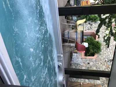 an image of a swimming pool and chairs at 1722 Chambres de Charme in Ville-di-Paraso