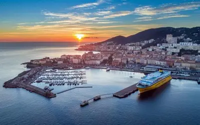 a cruise ship docked in a harbor with a city at Ajaccio appartement vielle ville - 4 personnes in Ajaccio