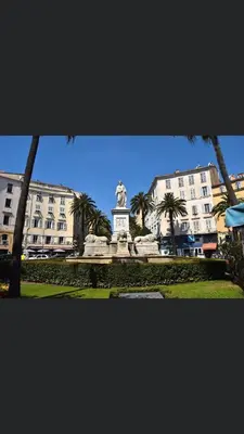 a statue in a park in front of a building at Ajaccio appartement vielle ville - 4 personnes in Ajaccio
