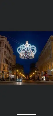 a christmas light hanging over a city street at night at Ajaccio appartement vielle ville - 4 personnes in Ajaccio