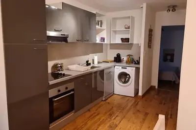 a kitchen with a washing machine and a washer at Ajaccio appartement vielle ville - 4 personnes in Ajaccio