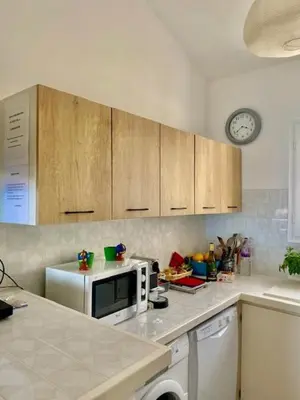 a kitchen with a counter top with a microwave at EL ORO - Terrasse Vue Mer et piscine - Porto Vecchio in Porto-Vecchio