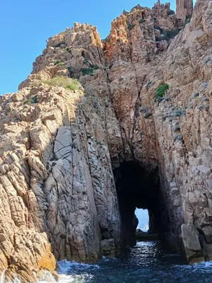 a cave in the side of a rocky mountain at Sottu E Stelle in Albitreccia