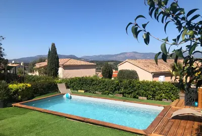 a swimming pool in the yard of a house at RINESA II in Porticcio