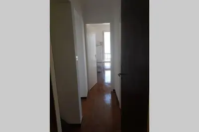 an empty hallway with a hallway leading to a kitchen at Location appartement propriano in Propriano
