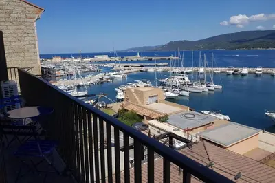 a view of a marina with boats in the water at Location appartement propriano in Propriano