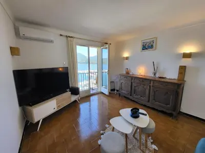 a living room with a large flat screen tv at Location appartement propriano in Propriano