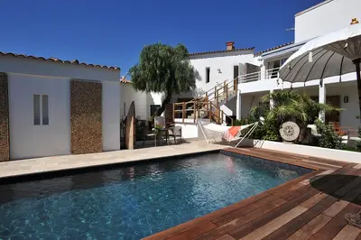 a swimming pool in the backyard of a house at Clemente en aparté sud in Lecci