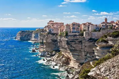 a city on a cliff next to the ocean at Résidence Standing Domaine d Arca in Porto-Vecchio
