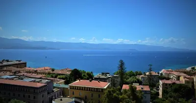 a city with a large body of water and buildings at Grand T2 STANDING AJACCIO Proche centre et plages VUE PANORAMIQUE PARKING PRIVE in Ajaccio