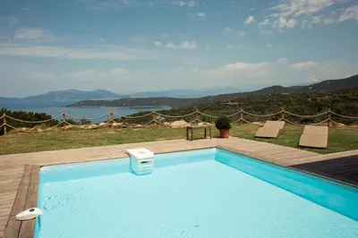 a swimming pool with a view of the water at Villa BARQUIERO in Coti-Chiavari