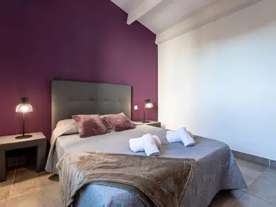 a bedroom with a bed with two towels on it at Holiday Home Pietralunga-1 by Interhome in Sotta