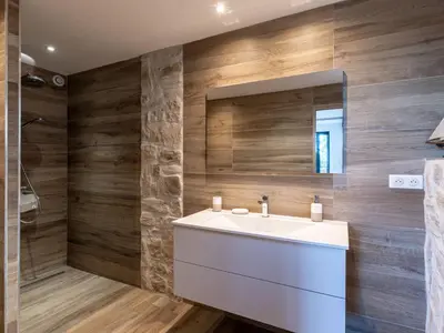 a bathroom with a white sink and a mirror at Holiday Home Pietralunga-1 by Interhome in Sotta