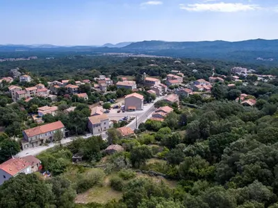 an aerial view of a small town with houses and trees at Holiday Home Pietralunga-1 by Interhome in Sotta