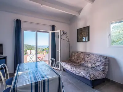 a living room with a couch and a couch and a window at Holiday Home Pietralunga-1 by Interhome in Sotta