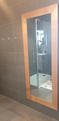 a mirror in a bathroom with a shower at Appartement neuf T2 centre de Porticcio in Porticcio
