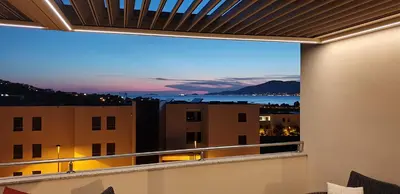 a balcony with a view of a city at Appartement neuf T2 centre de Porticcio in Porticcio