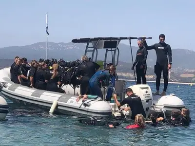a group of people on a boat in the water at Appartement neuf T2 centre de Porticcio in Porticcio