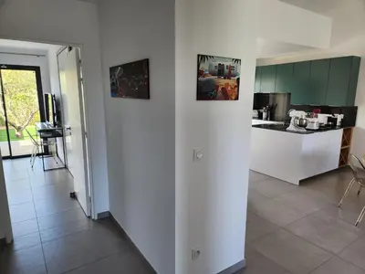 a living room with a table and a couch at Villa HOME HOLIDAY à Cala Rossa in Lecci