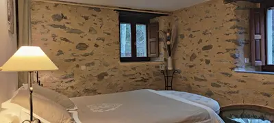 a bedroom with a bed with a lamp in it at U Vechju Mulinu in Ortiporio