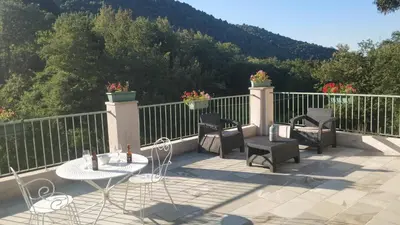 a patio with chairs and tables on a balcony at U Caseddu 