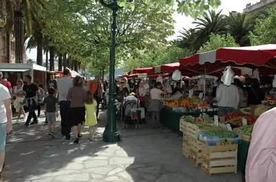 a crowd of people walking around an outdoor market at studio cosy centre ville in Ajaccio