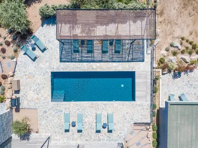 an overhead view of a swimming pool with a building at Villa 20 in Sainte-Lucie de Porto-Vecchio