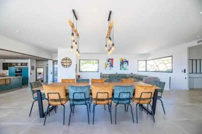 a dining room with a table and chairs at Villa 20 in Sainte-Lucie de Porto-Vecchio