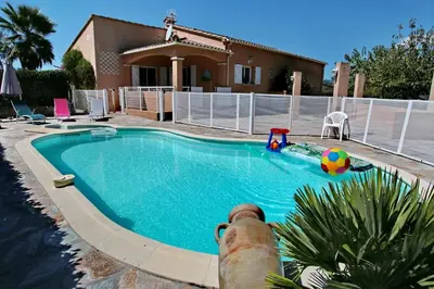 a swimming pool in front of a house at Di Felicita in Albitreccia
