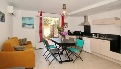a kitchen and living room with a table and chairs at Studio Di Felicita in Cauro