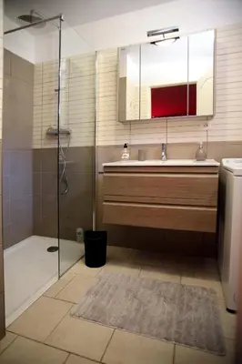 a bathroom with a sink and a shower with a mirror at Studio Di Felicita in Cauro