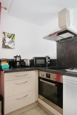 a kitchen with a stove and a microwave at Studio Di Felicita in Cauro