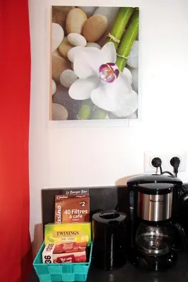 a counter top with a coffee pot and a box of food at Studio Di Felicita in Cauro
