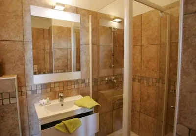 a bathroom with a sink and a shower at A Balamata in Cervione