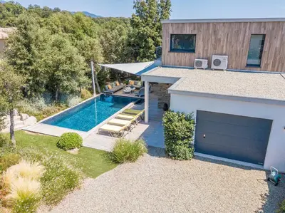 a house with a swimming pool next to a building at Porto Vecchio Villa Bagatelle 8 personnes in Porto-Vecchio