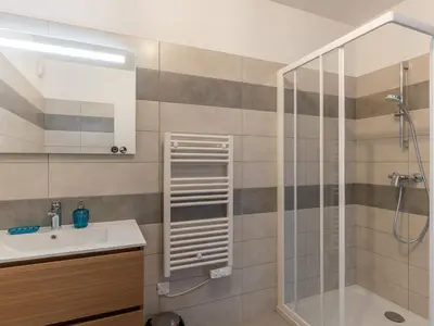 a bathroom with a sink and a shower at Apartment St Joseph-1 by Interhome in Porto-Vecchio